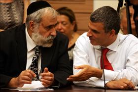 Knesset  Members, Nissim Ze'ev from Shas and Moshe Kahlon from the Likud at a Knesset meeting. Photograph; Kobi Gideon, Flash 90.