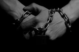 Hands in chains, source: publicdomainpictures.net